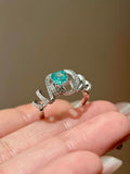 Paraiba Glow adjustable ring with bright color stone and wrap detail
