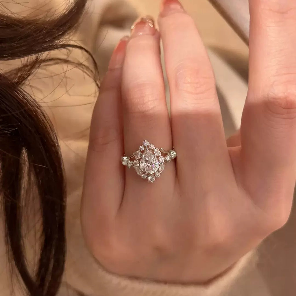 Oval crystal halo statement ring in silver tone
Sparkling oval center stone with decorative halo
Vintage-inspired oval crystal ring worn on hand
Side view of oval halo statement ring
Nanlnn silver-tone sparkling statement ring